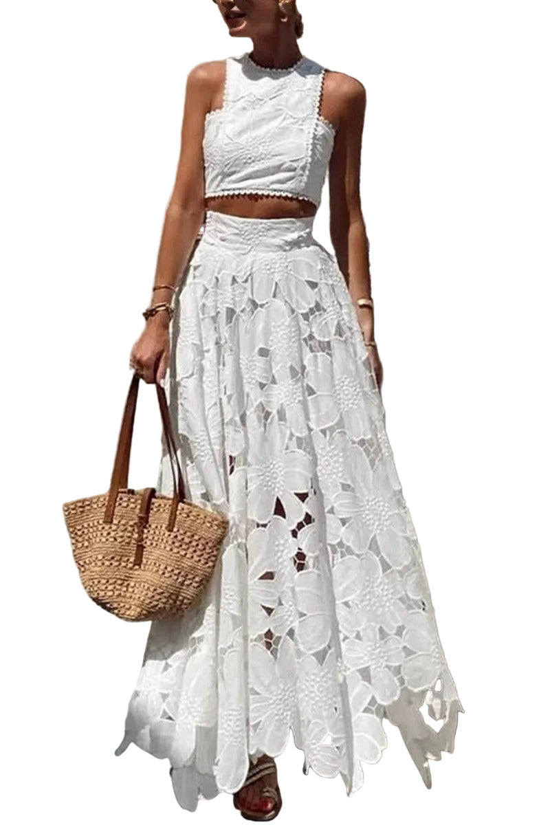 Woman wearing a white lace outfit with a straw bag