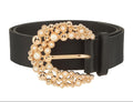 Black belt with a gold and pearl buckle on a white background