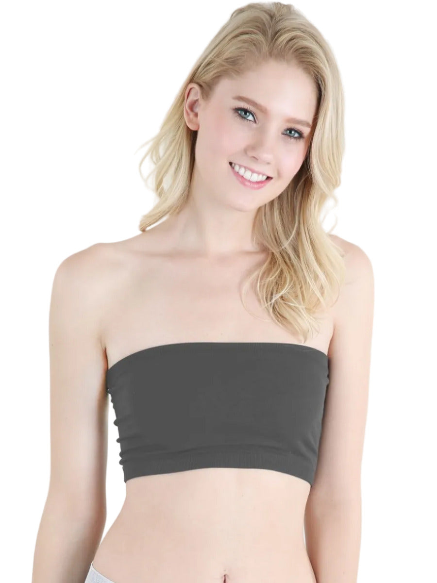 Woman wearing a charcoal gray tube top against a white background