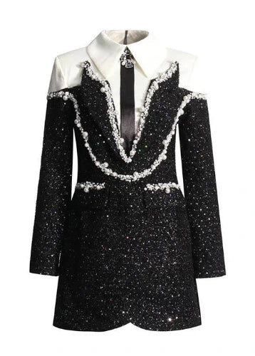 Black and white dress with embellishments on a white background