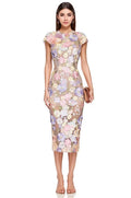 Woman wearing a floral dress on a white background
