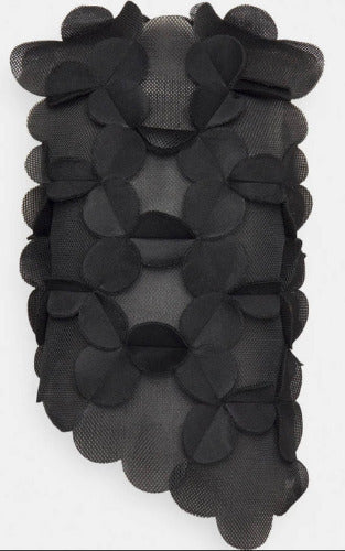 Black floral lace trim on a white background