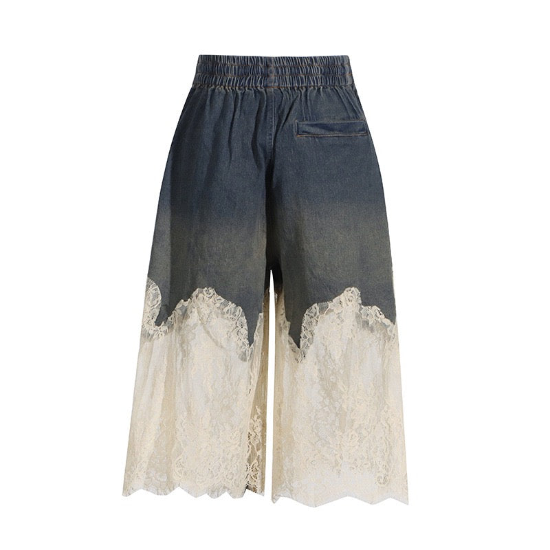 Denim shorts with lace trim on a white background
