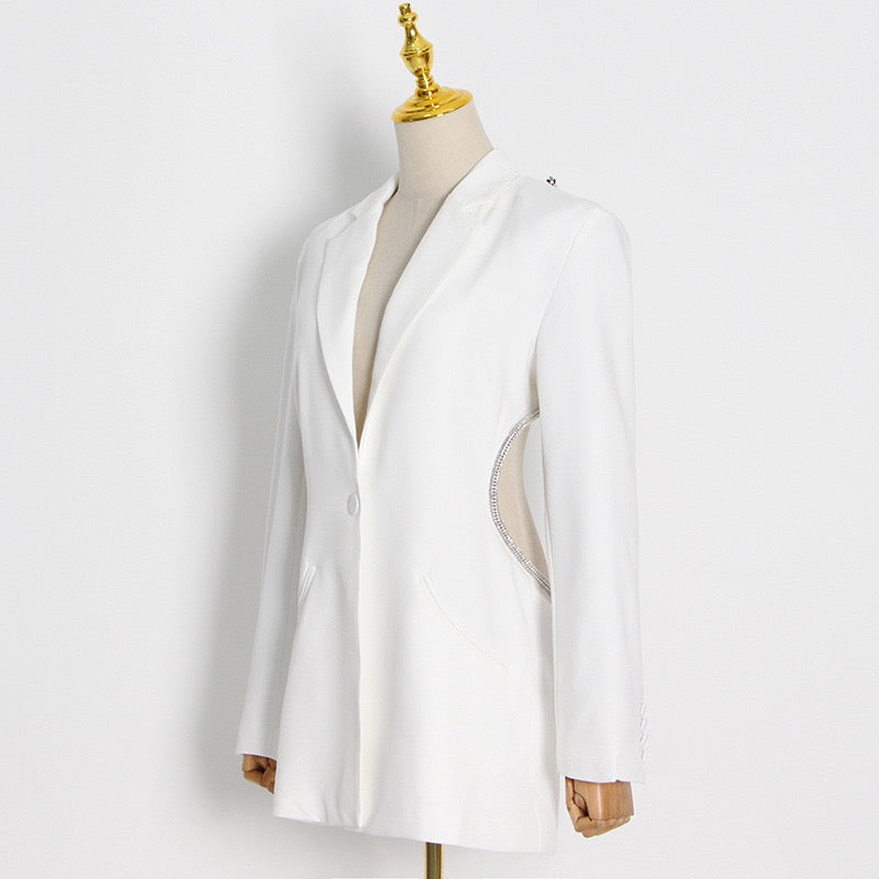 White blazer on a mannequin against a white background