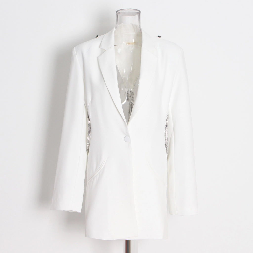 White blazer on a mannequin against a white background